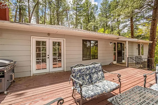 a view of a yard with wooden fence