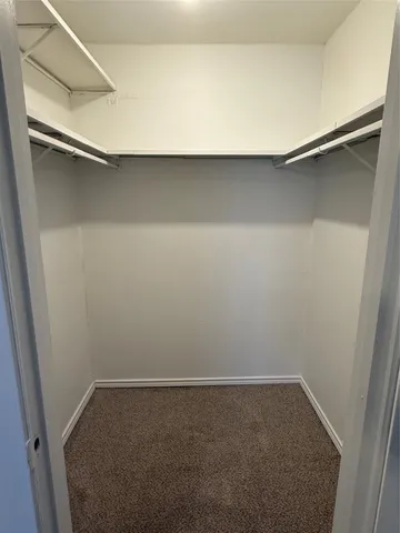a bathroom with a granite countertop sink a toilet and bathtub