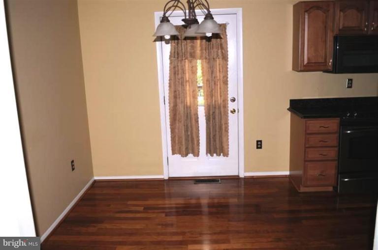 951 Waugh Chapel Road Gambrills, MD 21054 - Photo 13 of 17 a view of a entryway door with wooden floor
