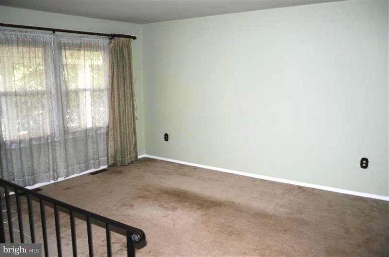 951 Waugh Chapel Road Gambrills, MD 21054 - Photo 14 of 17 a view of an empty room with a window
