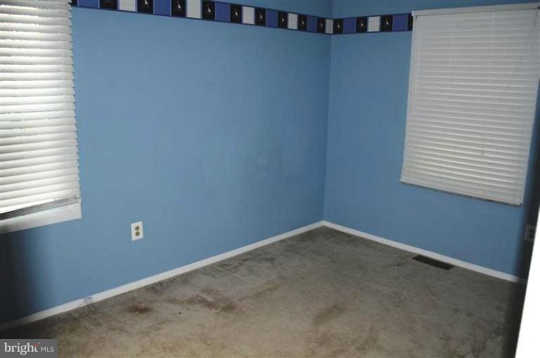 951 Waugh Chapel Road Gambrills, MD 21054 - Photo 3 of 17 a view of an empty room with a window