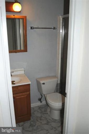 951 Waugh Chapel Road Gambrills, MD 21054 - Photo 5 of 17 a bathroom with a toilet and a sink