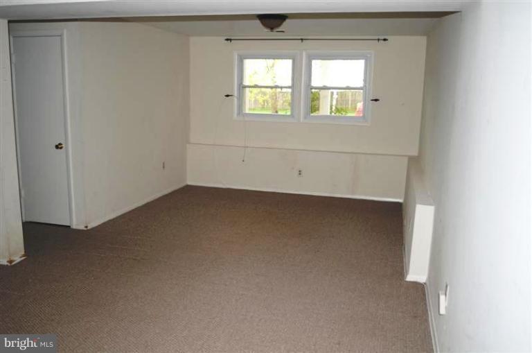951 Waugh Chapel Road Gambrills, MD 21054 - Photo 6 of 17 an empty room with a window