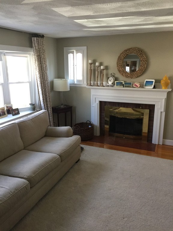 6 Robinson Road Woburn, MA 01801 - Photo 3 of 10 a living room with furniture and a fireplace