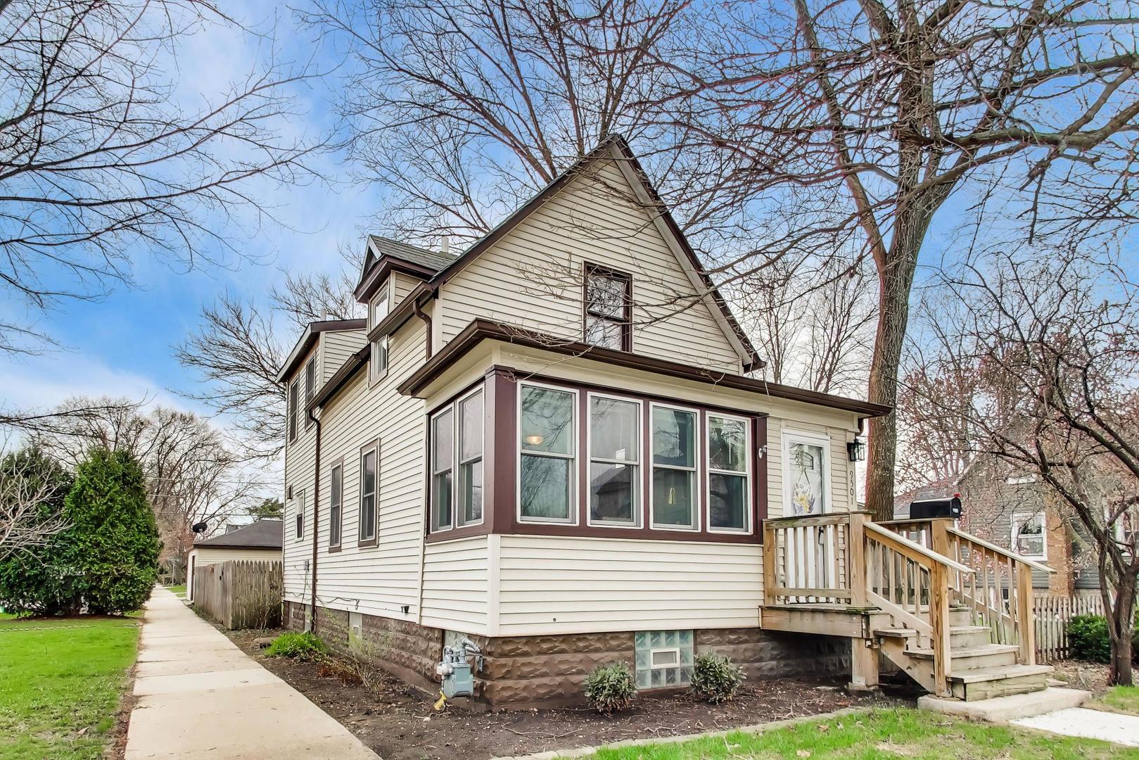 9501 Jackson Avenue Brookfield, IL 60513 - Photo 1 of 1 a front view of a house with a yard and garage