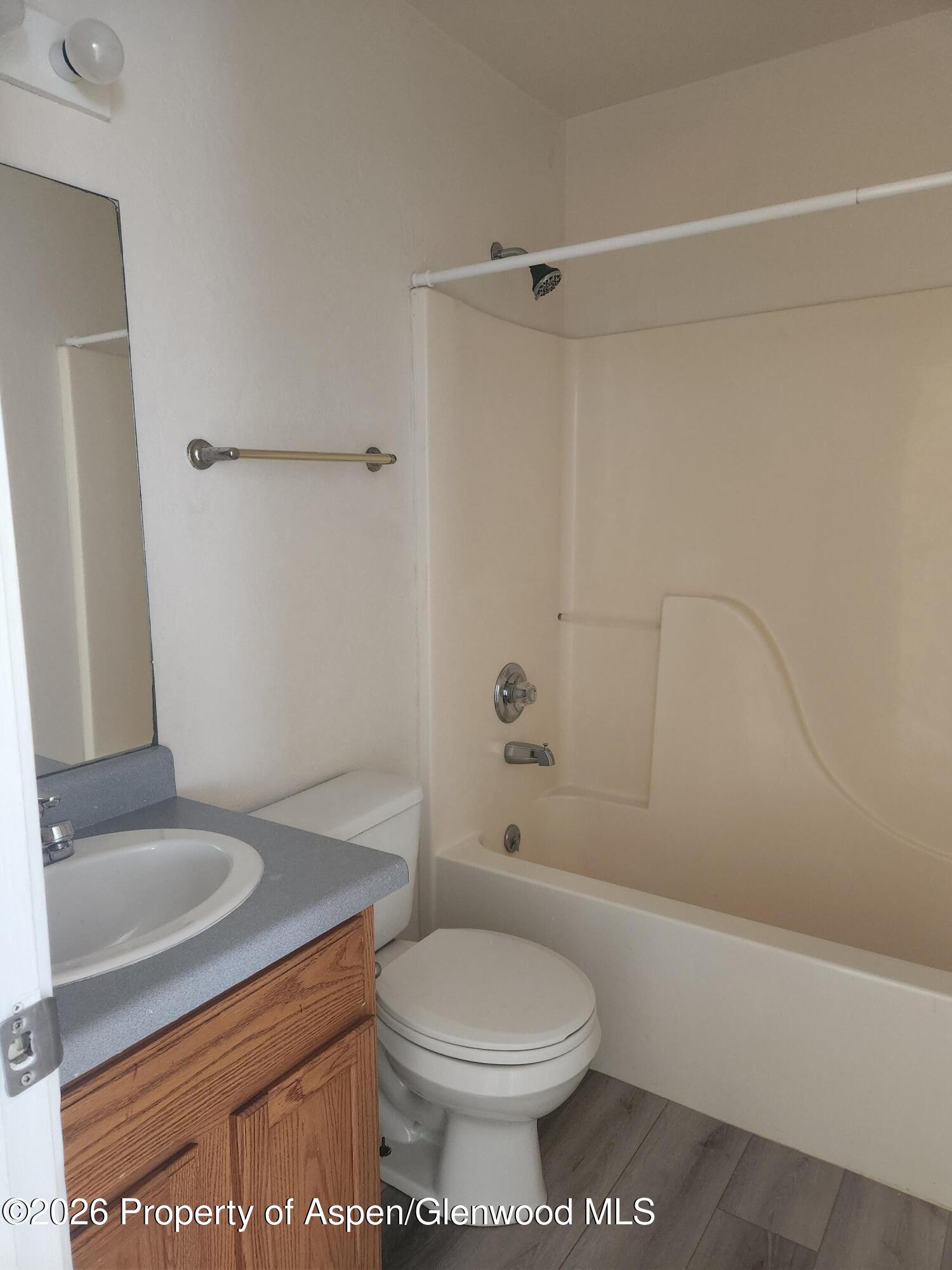 883 Taugenbaugh Boulevard Rifle, CO 81650 - Photo 13 of 18 a bathroom with a sink a toilet and shower