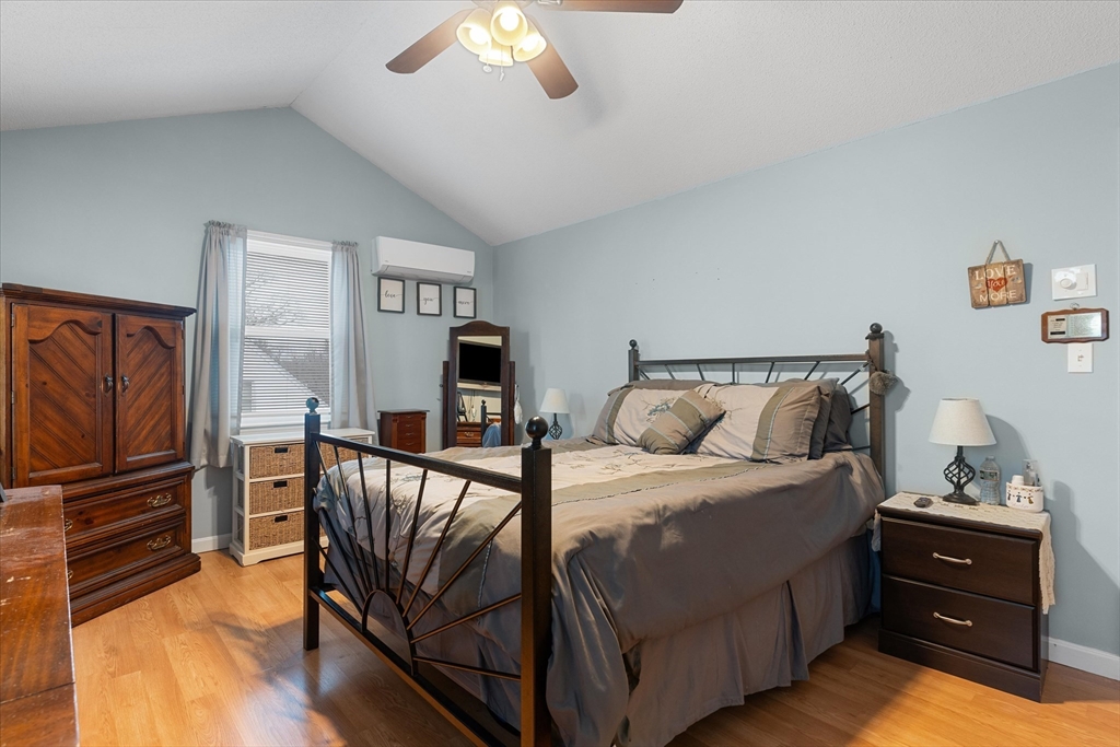 62 Valley Road Dracut, MA 01826 - Photo 14 of 35 a bedroom with a bed and a television