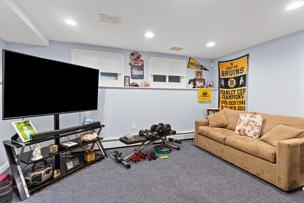 62 Valley Road Dracut, MA 01826 - Photo 19 of 35 a living room with furniture and a flat screen tv