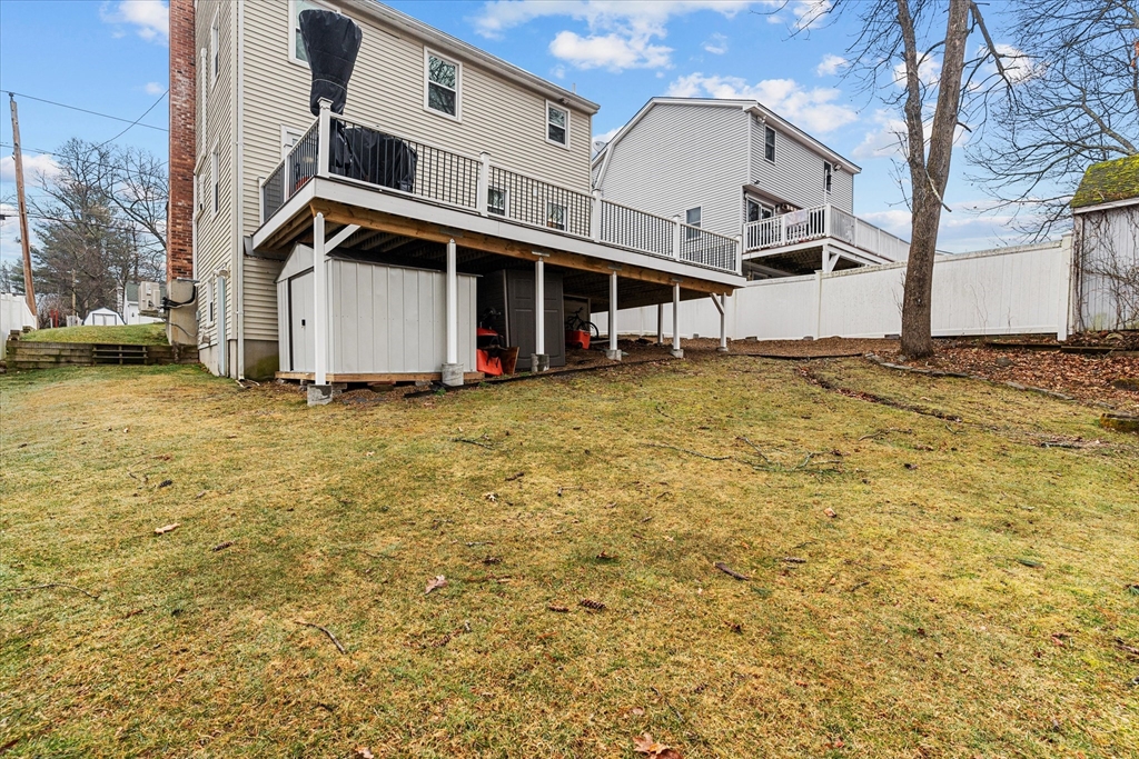 62 Valley Road Dracut, MA 01826 - Photo 26 of 35 a front view of a house with a yard