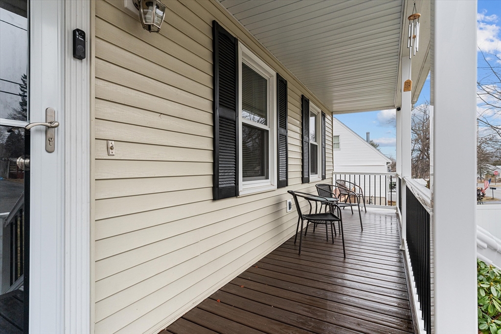 62 Valley Road Dracut, MA 01826 - Photo 3 of 35 a view of a wooden chairs on the deck