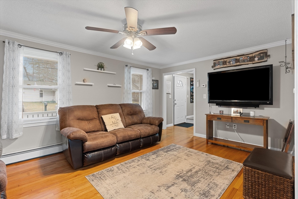 62 Valley Road Dracut, MA 01826 - Photo 5 of 35 a living room with furniture and a flat screen tv