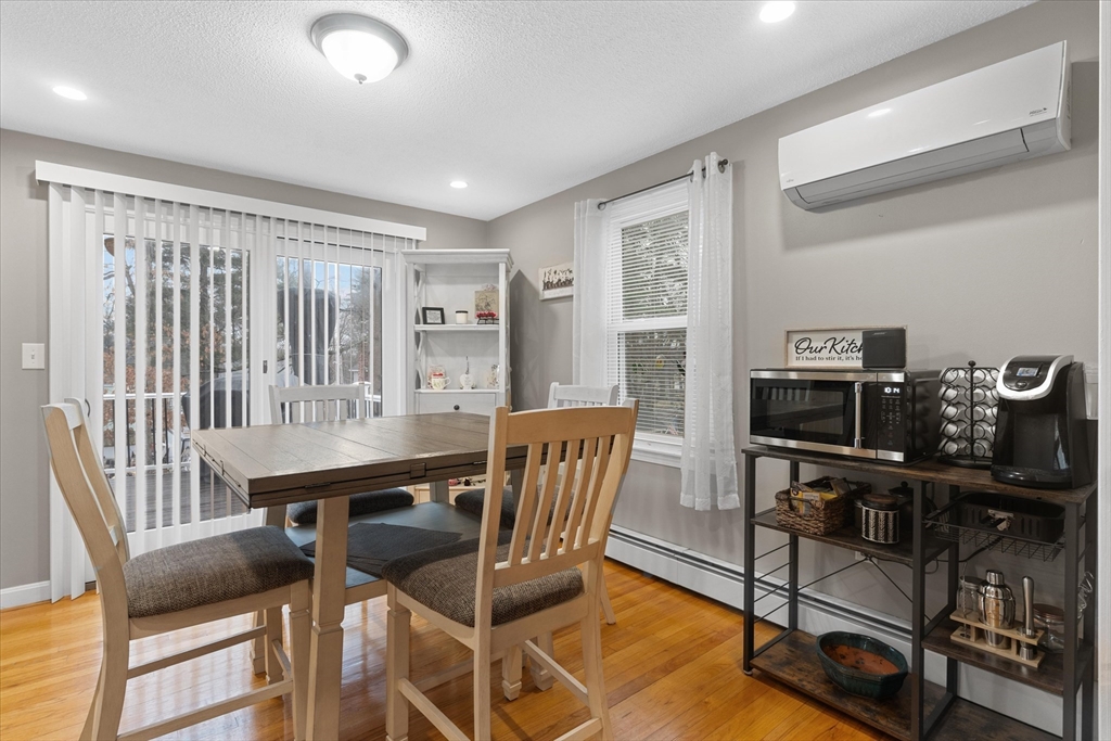 62 Valley Road Dracut, MA 01826 - Photo 8 of 35 a view of a dining room with furniture and a window