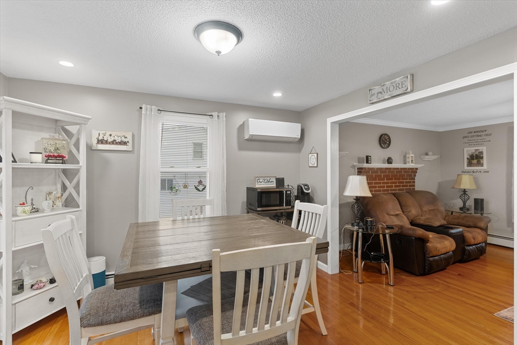 62 Valley Road Dracut, MA 01826 - Photo 10 of 35 a living room with furniture and wooden floor