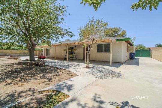 900 North Sierra View Street Ridgecrest, CA 93555 - Photo 36 of 42 a front view of a house with a yard and garage