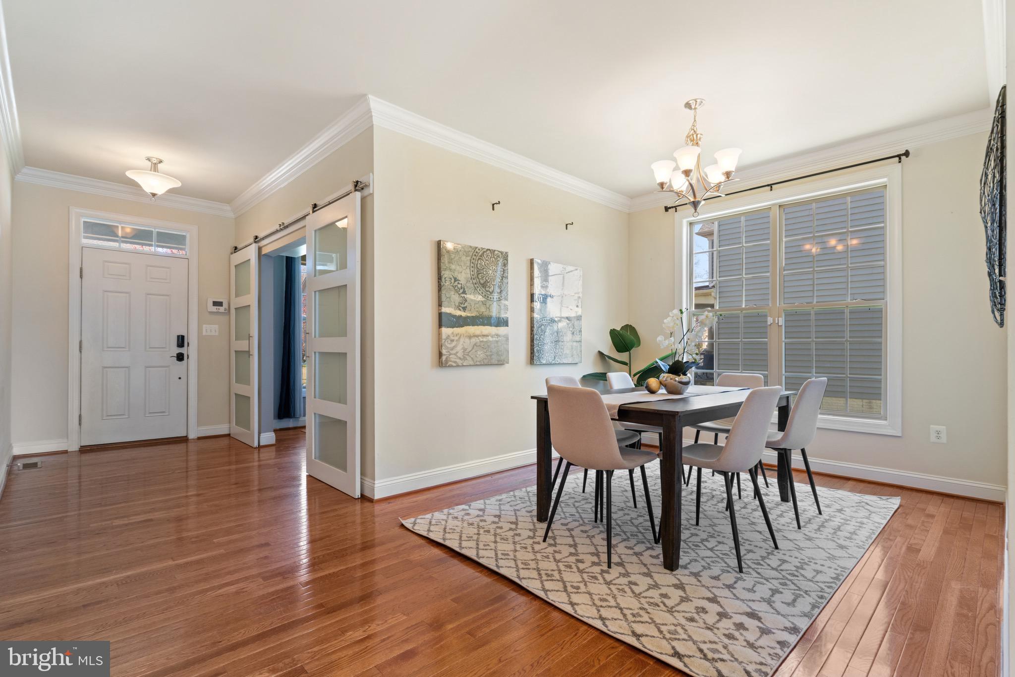 16277 Jetty Loop Woodbridge, VA 22191 - Photo 11 of 92 a view of a dining room with furniture and wooden floor