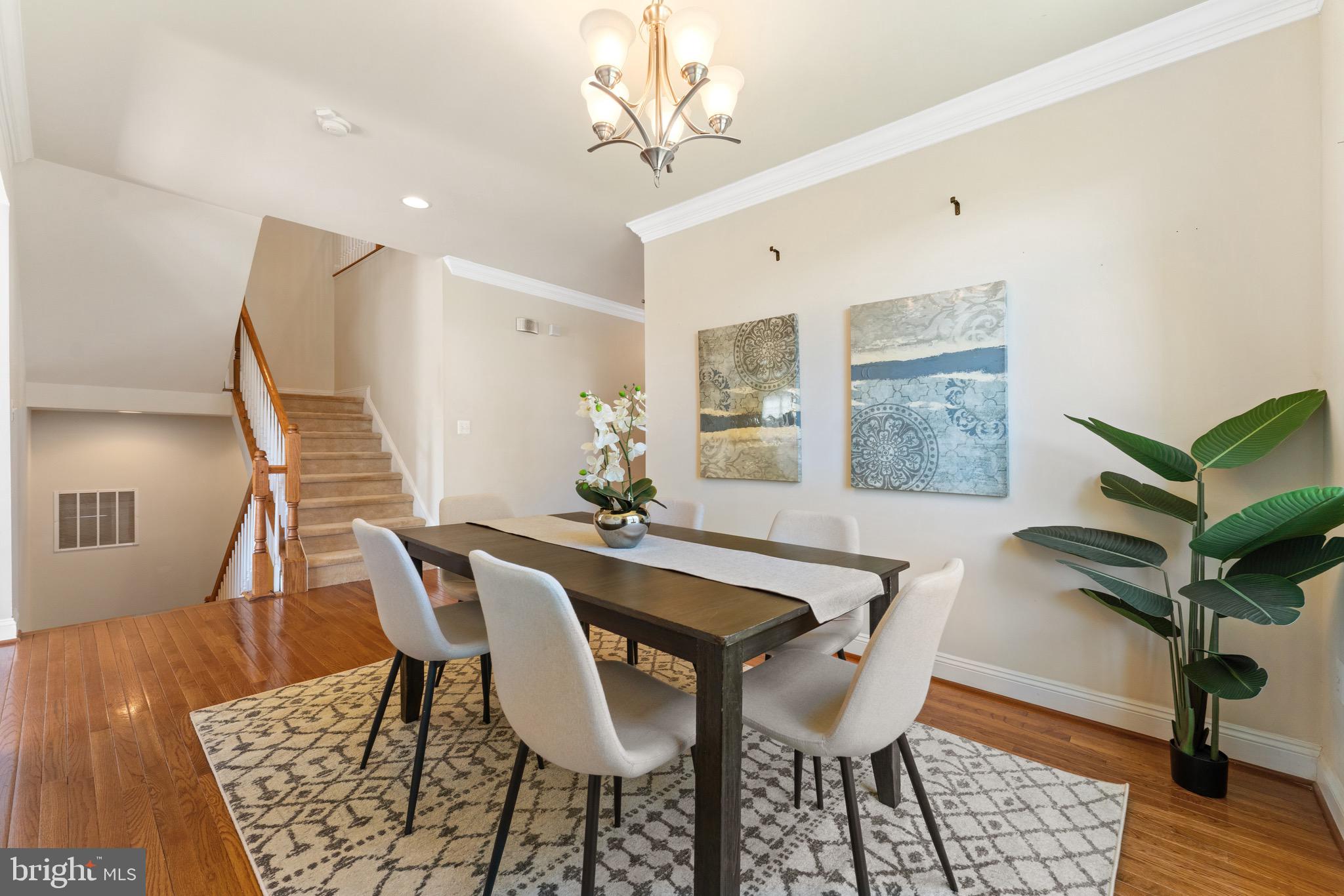 16277 Jetty Loop Woodbridge, VA 22191 - Photo 12 of 92 a view of a dining room with furniture and wooden floor