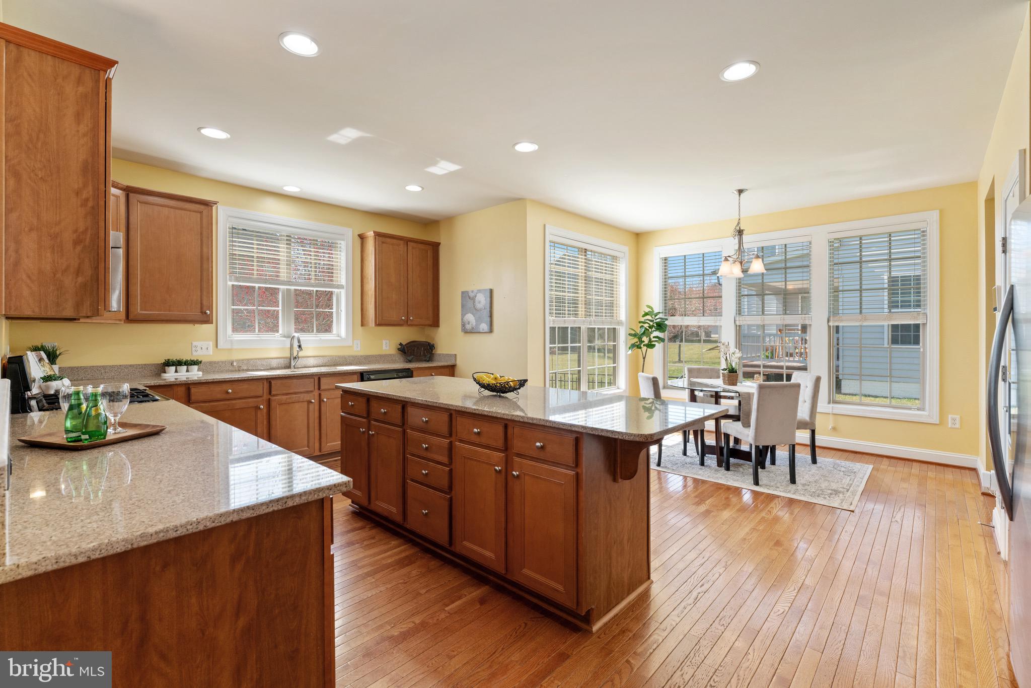 16277 Jetty Loop Woodbridge, VA 22191 - Photo 17 of 92 a kitchen with lots of counter top space and wooden floor