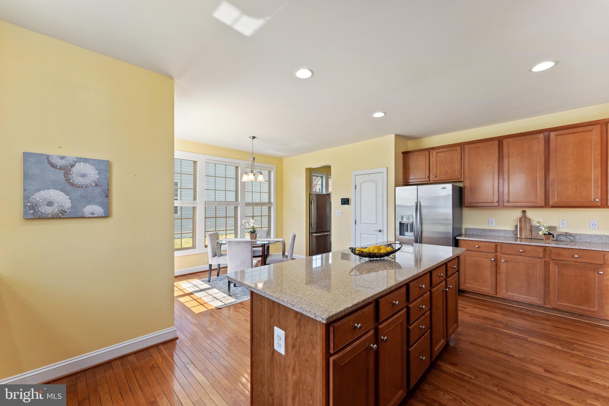 16277 Jetty Loop Woodbridge, VA 22191 - Photo 19 of 92 a kitchen with stainless steel appliances granite countertop a sink a stove and refrigerator