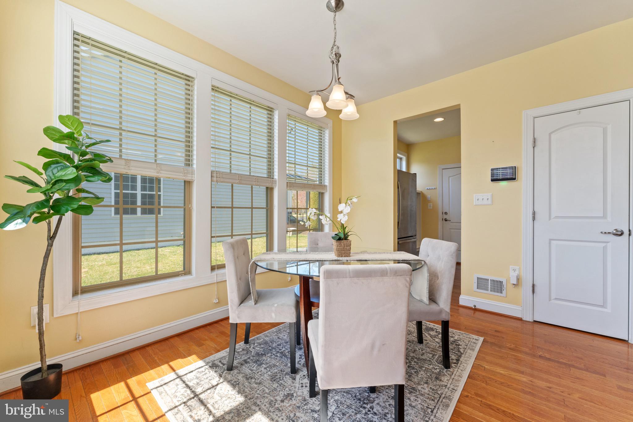16277 Jetty Loop Woodbridge, VA 22191 - Photo 28 of 92 a view of a dining room with furniture window and wooden floor