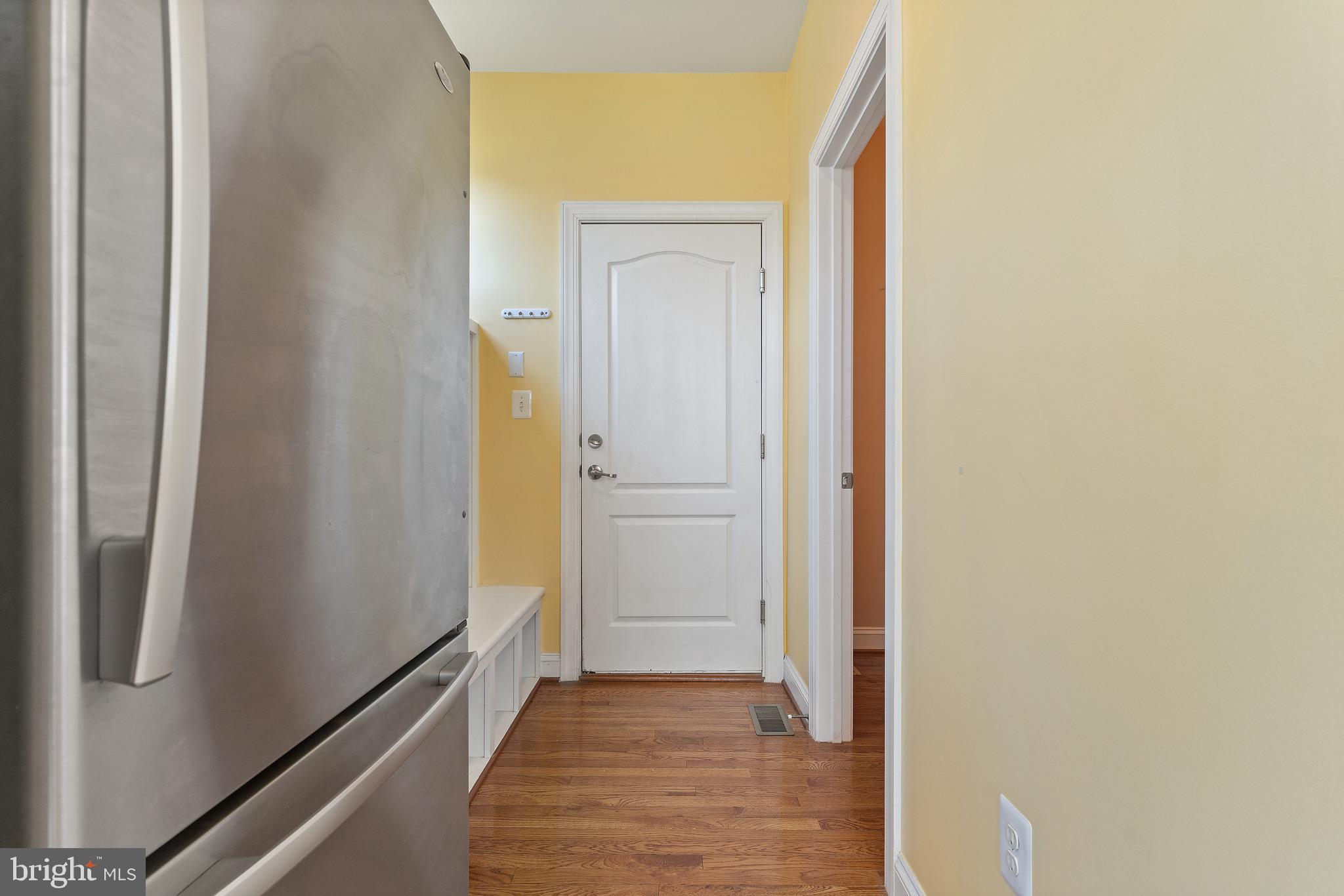 16277 Jetty Loop Woodbridge, VA 22191 - Photo 29 of 92 a view of a hallway with wooden floor and a bathroom