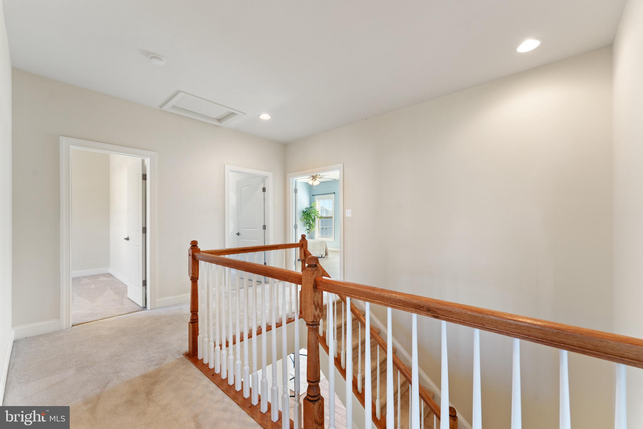 16277 Jetty Loop Woodbridge, VA 22191 - Photo 36 of 92 a view of a hallway with wooden floor and stairs