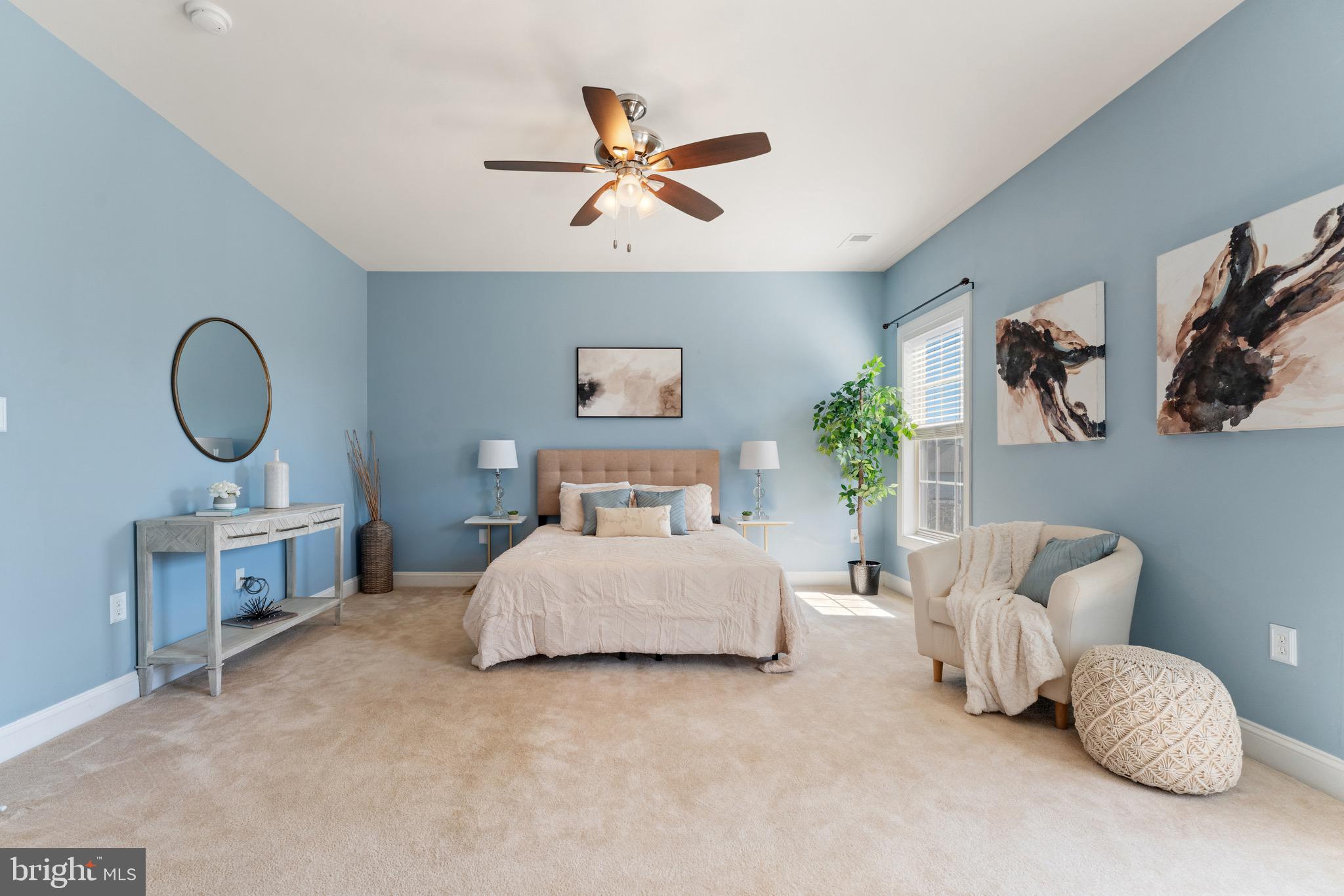 16277 Jetty Loop Woodbridge, VA 22191 - Photo 38 of 92 a bedroom with bed and a chandelier