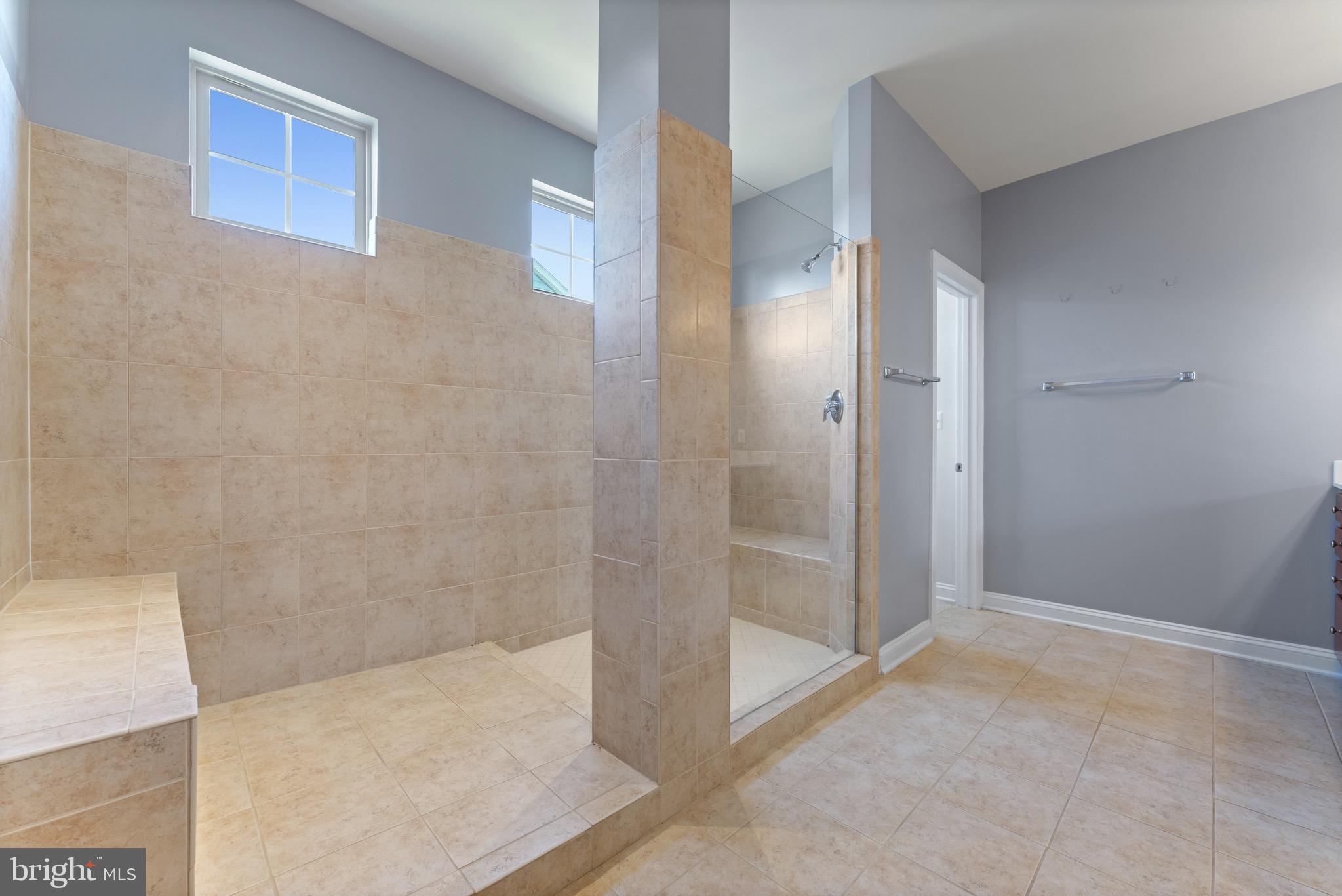 16277 Jetty Loop Woodbridge, VA 22191 - Photo 60 of 92 a bathroom with a glass shower door