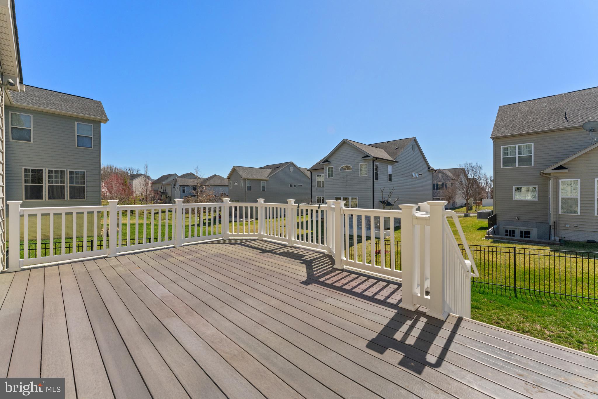 16277 Jetty Loop Woodbridge, VA 22191 - Photo 63 of 92 a view of a deck with wooden floor and fence with a large garden