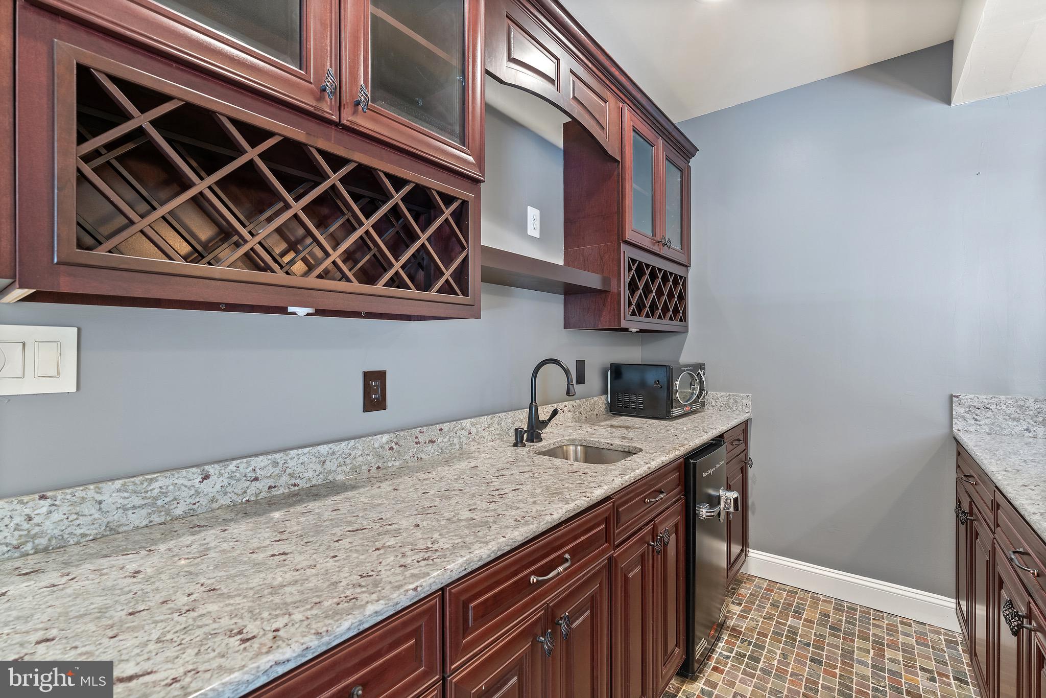 16277 Jetty Loop Woodbridge, VA 22191 - Photo 71 of 92 a kitchen with a sink and cabinets