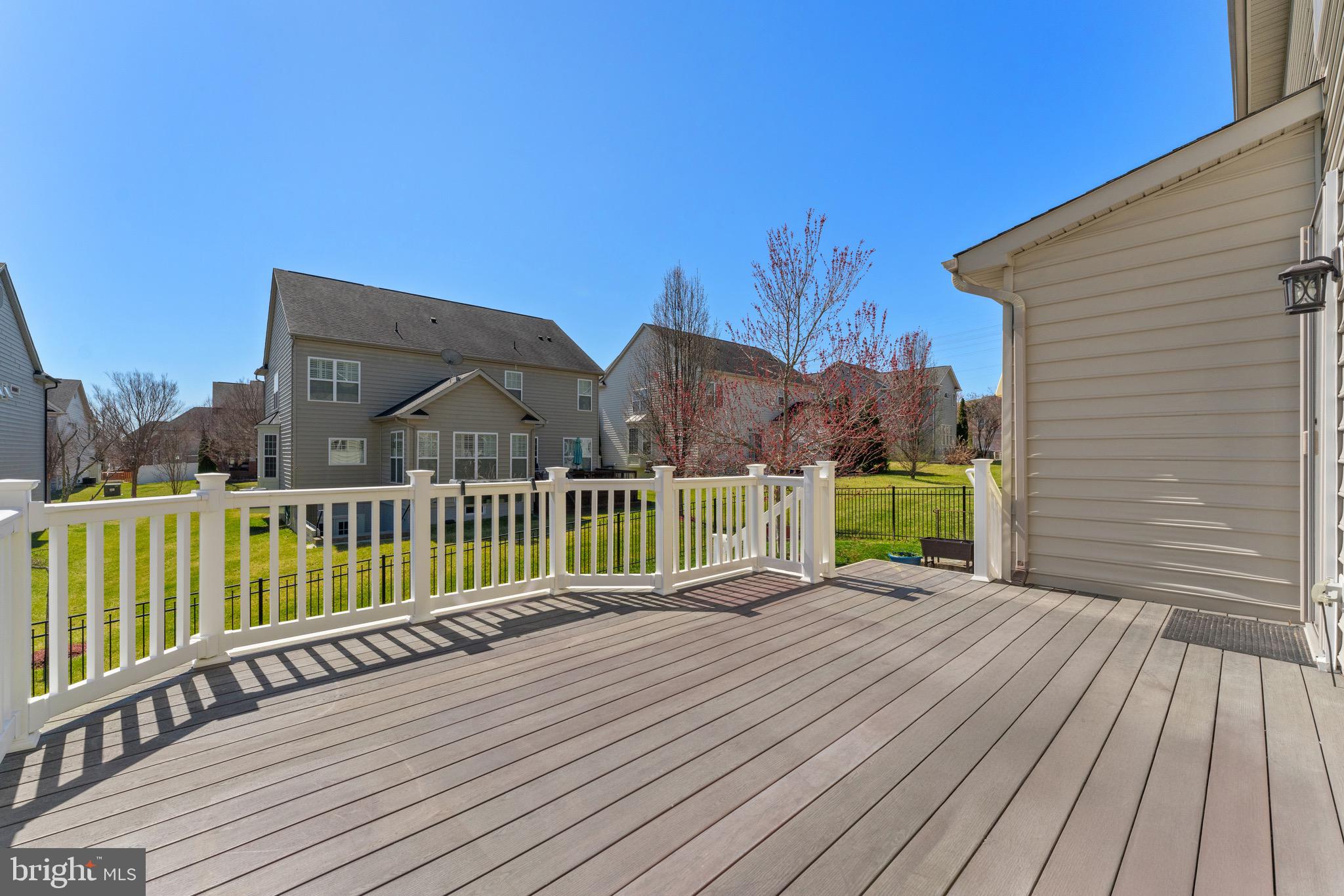 16277 Jetty Loop Woodbridge, VA 22191 - Photo 79 of 92 a view of a house with a wooden deck