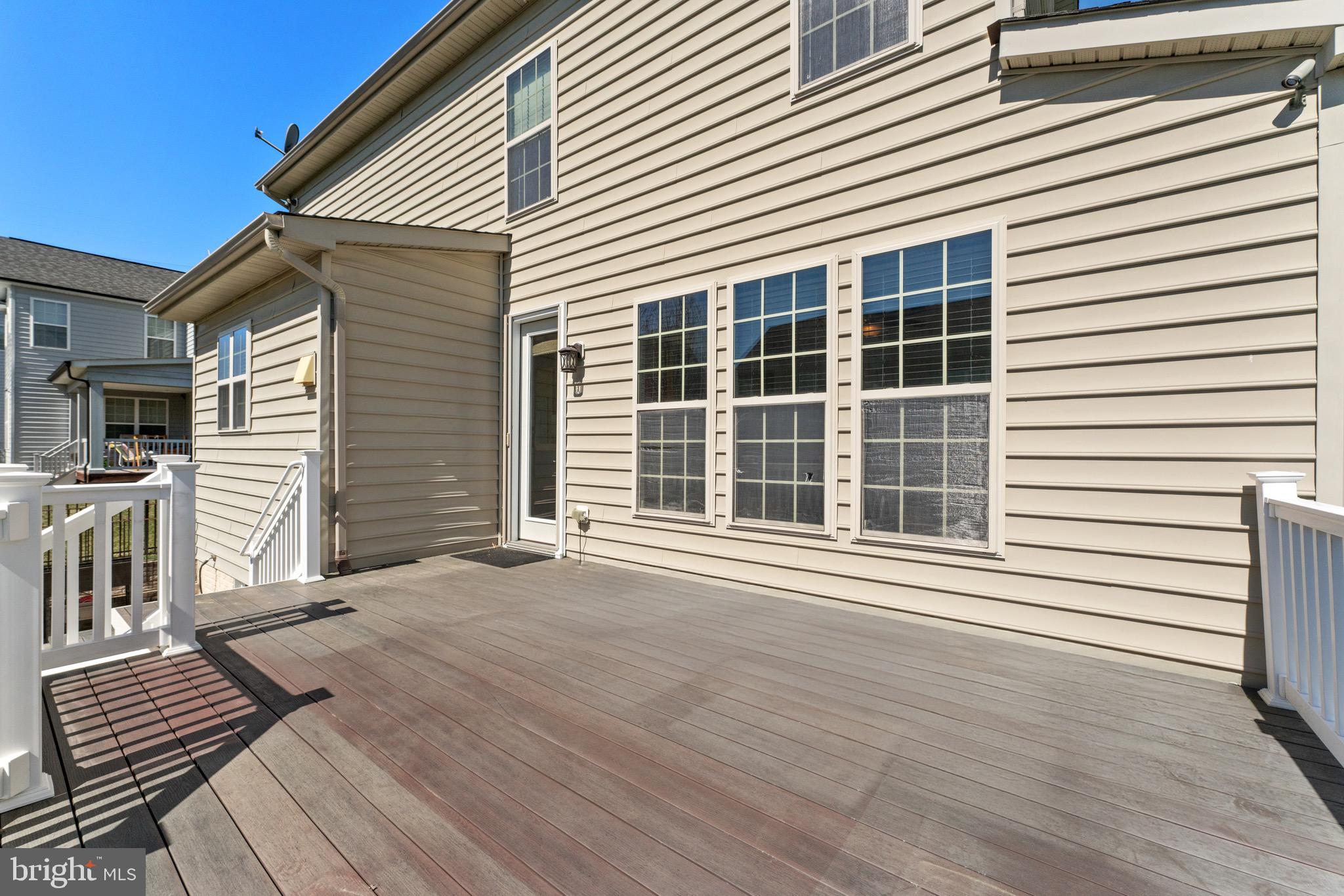 16277 Jetty Loop Woodbridge, VA 22191 - Photo 80 of 92 a view of a house with wooden deck