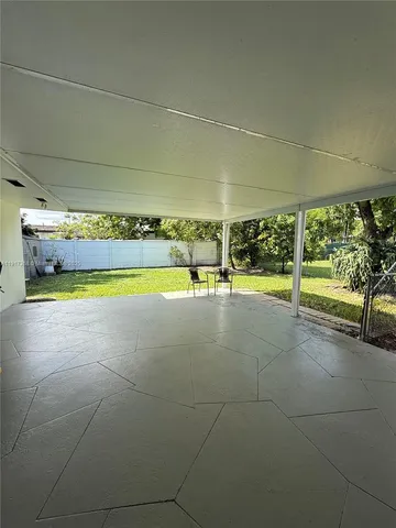 a view of a swimming pool with an outdoor space and seating area