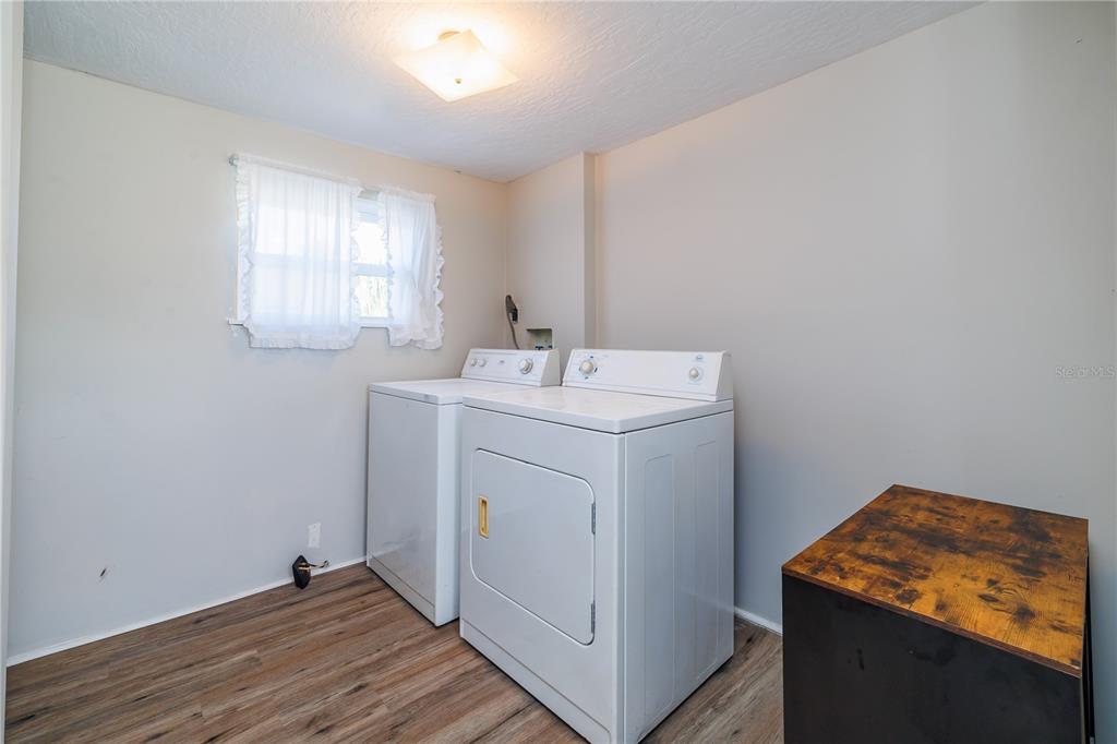412 Osprey Drive Sebastian, FL 32976 - Photo 17 of 35 a utility room with sink dryer and washer