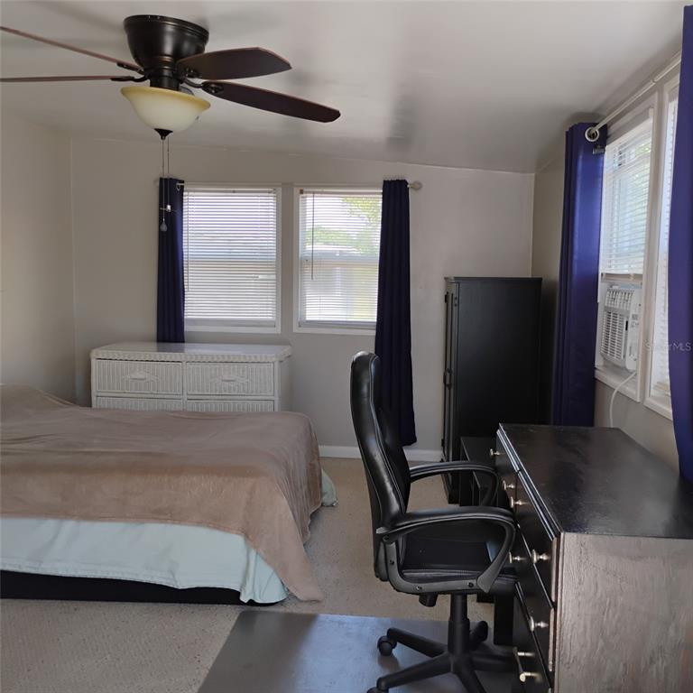 412 Osprey Drive Sebastian, FL 32976 - Photo 18 of 35 a view of a workspace with furniture and a window