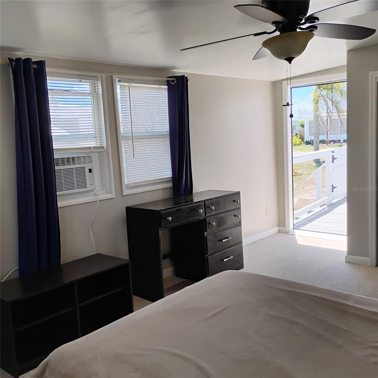 412 Osprey Drive Sebastian, FL 32976 - Photo 19 of 35 a bedroom with a bed and a window