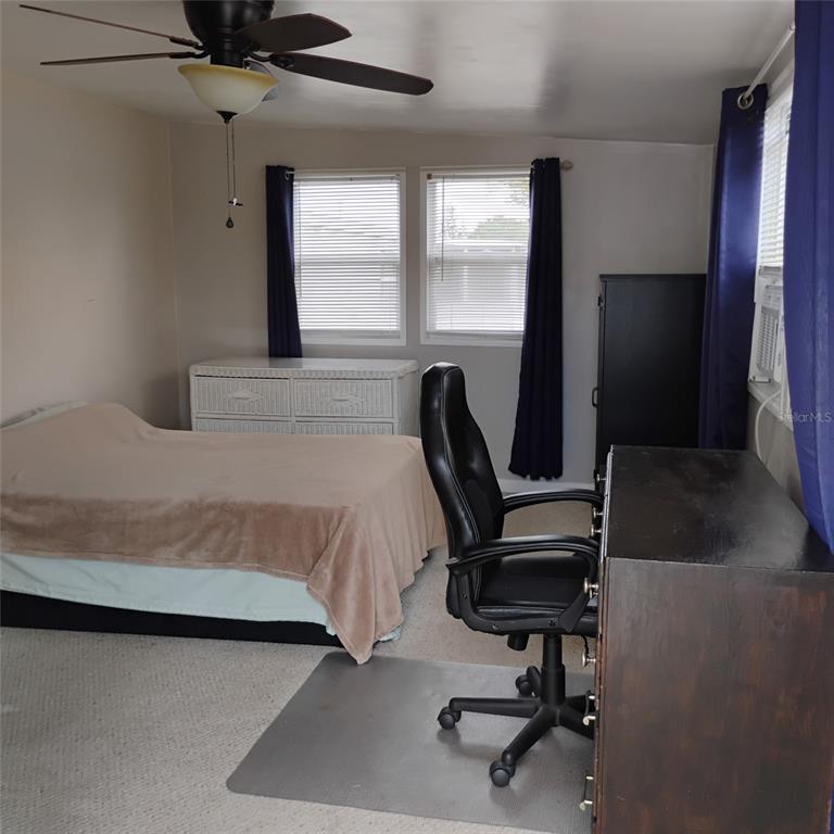 412 Osprey Drive Sebastian, FL 32976 - Photo 21 of 35 a bedroom with a bed and a window