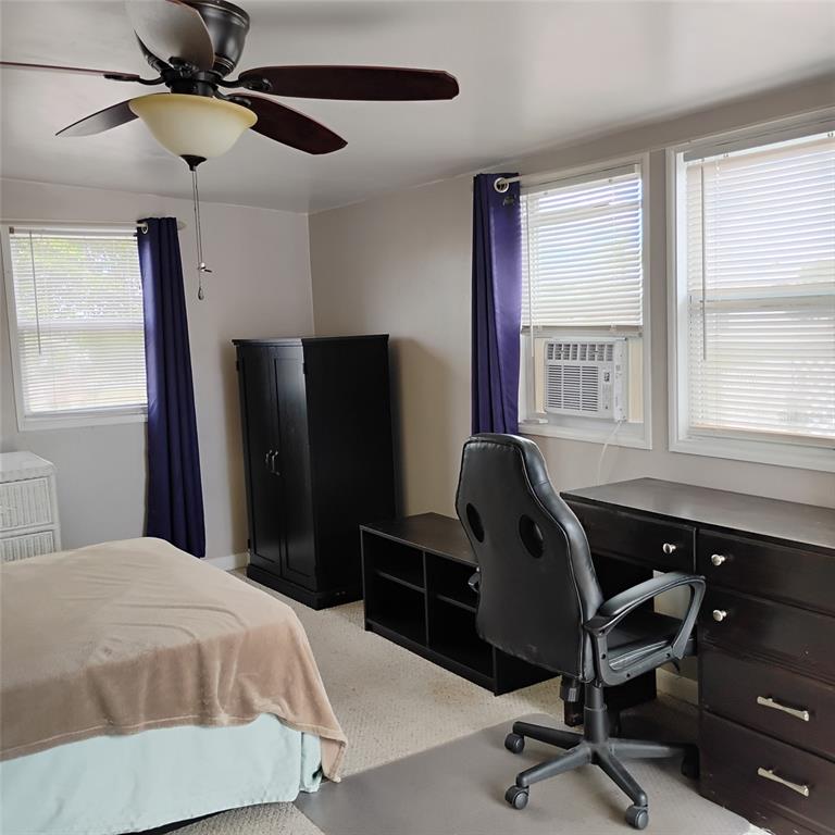 412 Osprey Drive Sebastian, FL 32976 - Photo 22 of 35 a bedroom with a bed and a window