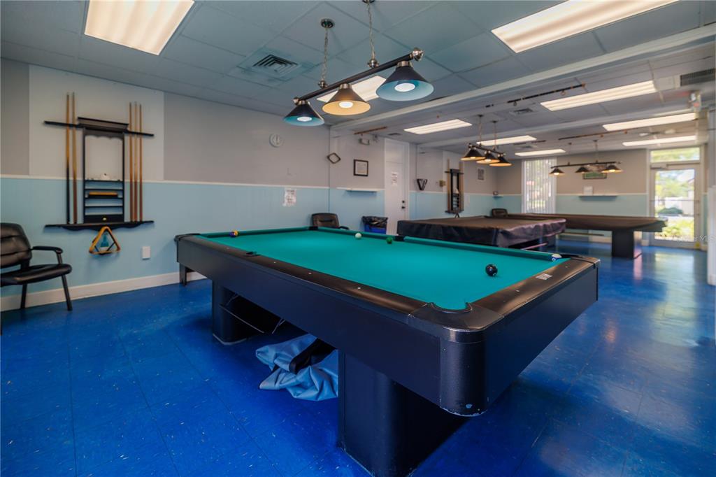 412 Osprey Drive Sebastian, FL 32976 - Photo 31 of 35 a room with pool table windows and wooden floor
