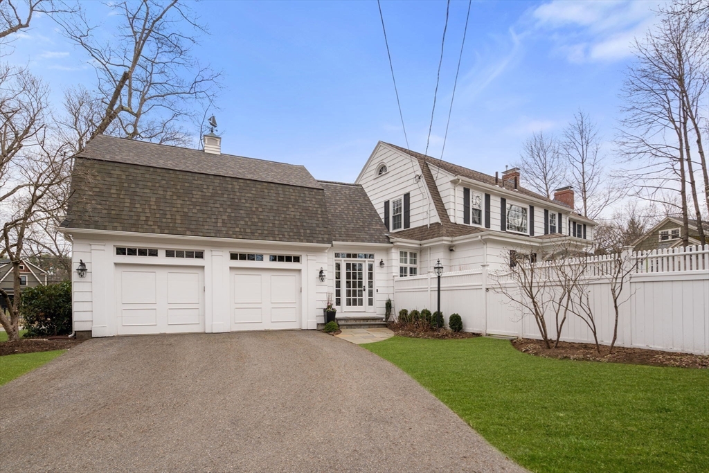 11 Mossfield Road Newton, MA 02468 - Photo 31 of 32 a front view of a house with a yard and garage