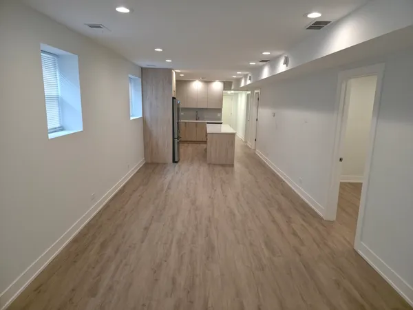 a view of kitchen with wooden floor