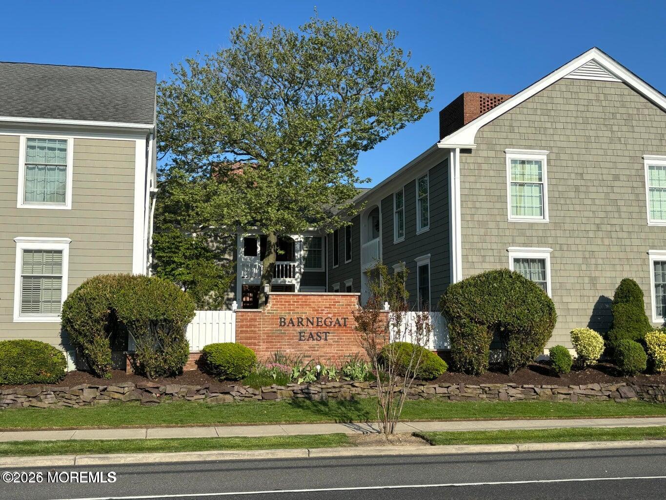 21 Mount Street, Unit B3 Bay Head, NJ 08742 - Photo 14 of 17 a view of a house with a yard and sitting area