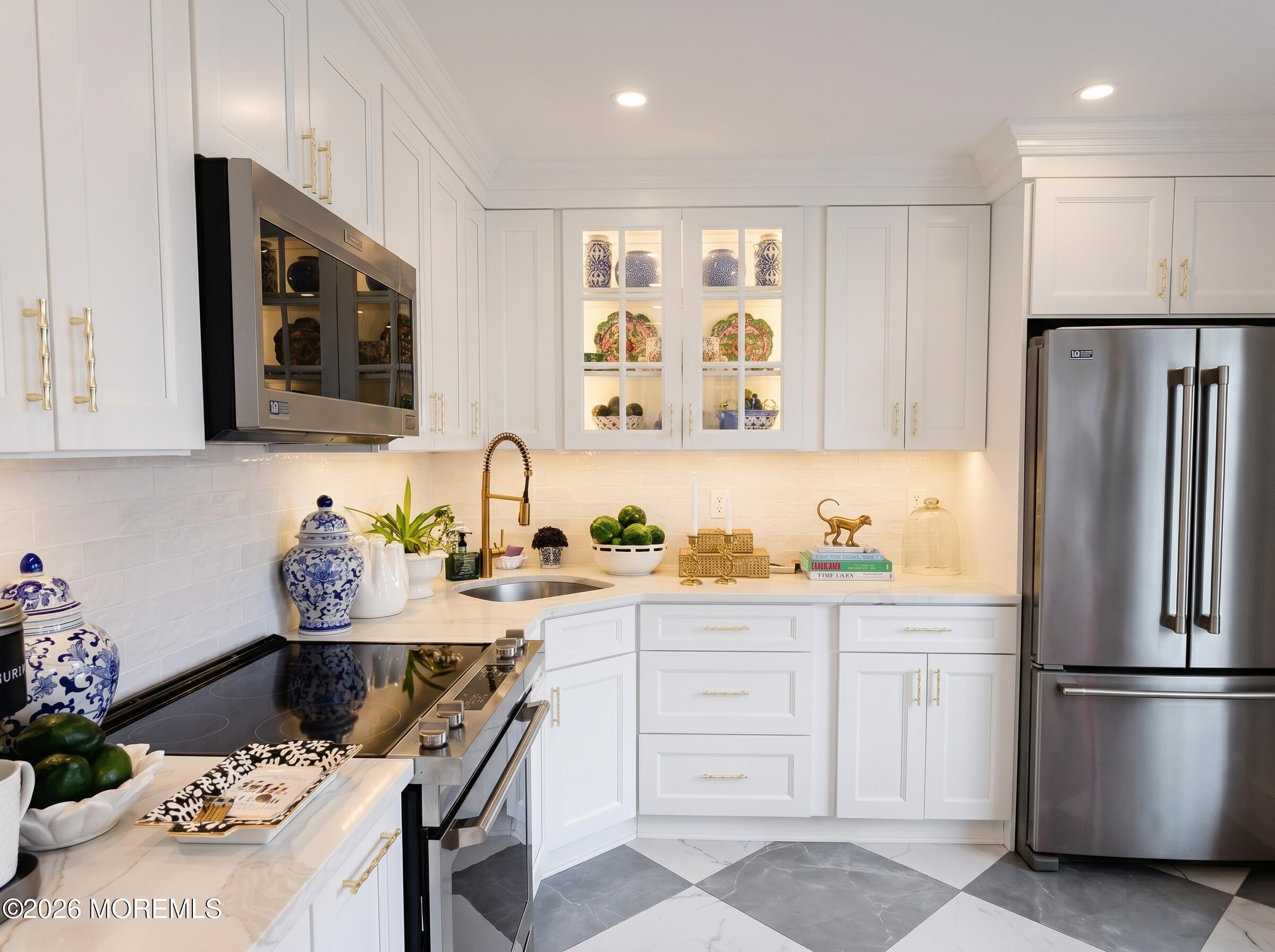 21 Mount Street, Unit B3 Bay Head, NJ 08742 - Photo 4 of 17 a kitchen with stainless steel appliances a refrigerator sink and cabinets