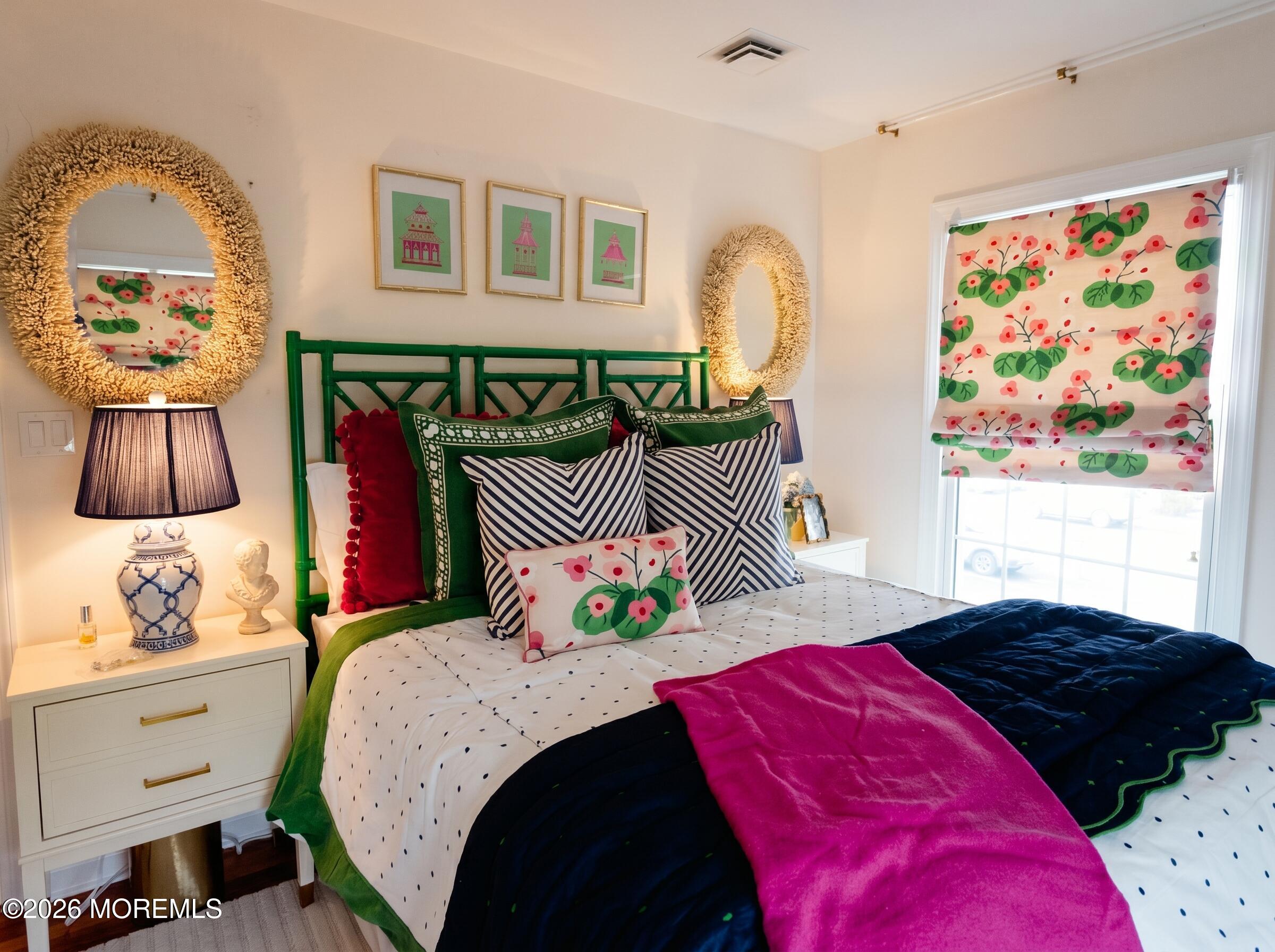 21 Mount Street, Unit B3 Bay Head, NJ 08742 - Photo 8 of 17 a bedroom with a bed and a painting on the wall