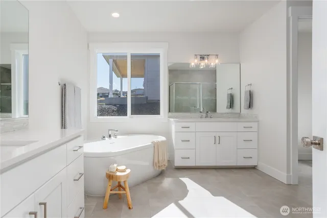 a bathroom with a double vanity sink and a mirror
