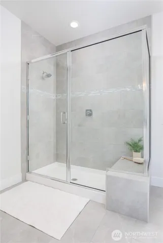 a white tub sitting next to a window