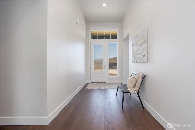 a view of a dining room with furniture and a window