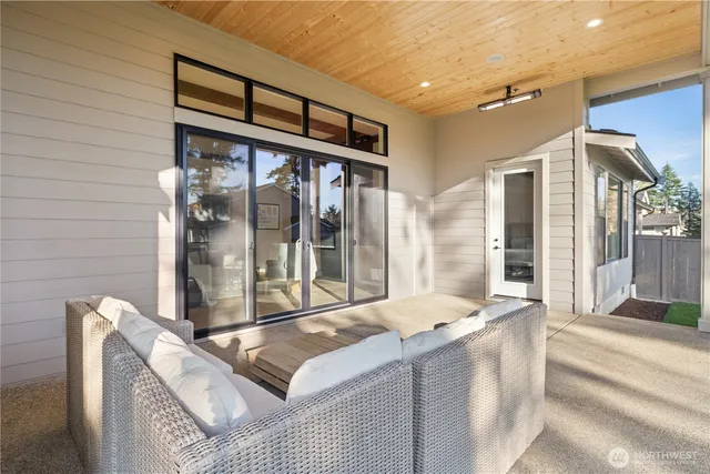 a view of a patio with couches and a fire pit