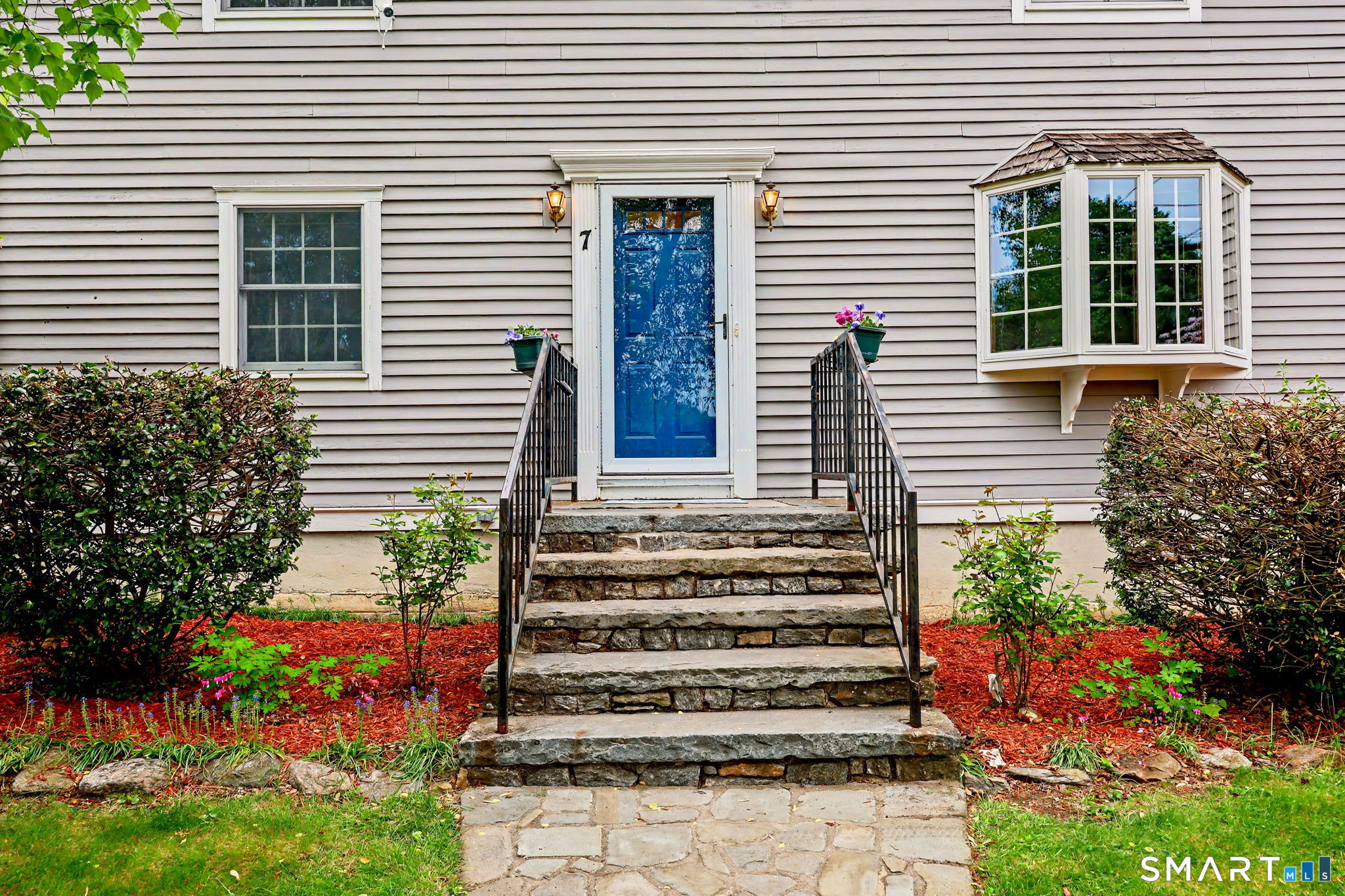 7 Merrill Road Trumbull, CT 06611 - Photo 3 of 40 a front view of a house with a garden
