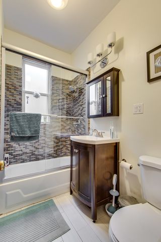 a bathroom with a sink a toilet and bathtub