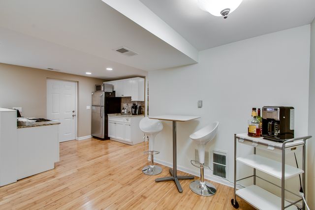 a kitchen with a table and chairs in it